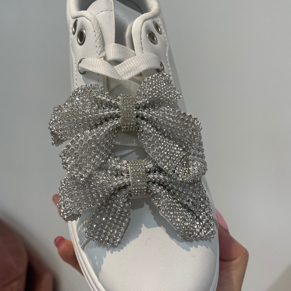 Elegant White Sneakers with Silver Bow Accents